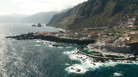 Beautiful-aerial-of-small-coastal-town-Porto-Moniz-travel-destination-of-Madeira