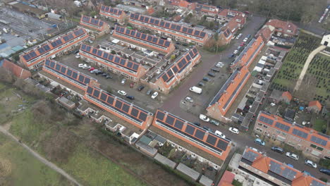 Aerial-of-suburban-neighborhood-with-solar-panels-on-rooftops