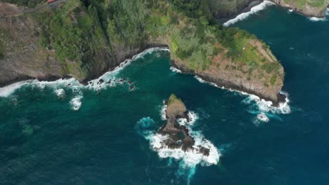 Aerial-of-rugged-wild-coast-of-Madeira-island-with-beautiful-blue-water