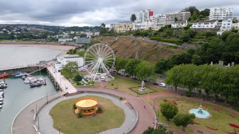 Ferris-Wheel-for-Tourists-on-Vacation-to-Resort-Town-of-Torquay,-England---Aerial