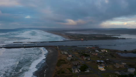 Mouth-Of-The-Coquille-River-Where-It-Meets-The-Pacific-Ocean-In-Bandon,-Oregon---aerial-pullback