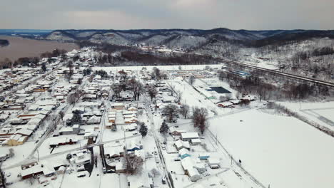 Aerial-view-of-snow-covered-Ironton,-Ohio,-the-Ohio-River,-and-Appalachians