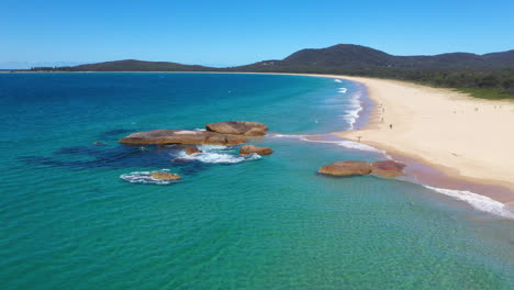 Majestic-paradise-beach-on-Australian-coast,-idyllic-aerial-arc-shot