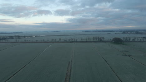 Aerial-dolly-of-frozen-Dutch-countryside-at-dawn