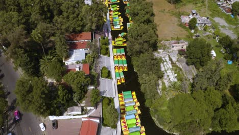 Drone-Flies-Above-Xochimilco-Canals-Full-of-Colorful-Trajineras-Near-Mexico-City