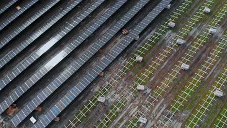 Solar-energy-farm-in-Partille,-Sweden,-wide-spinning-shot-directly-above