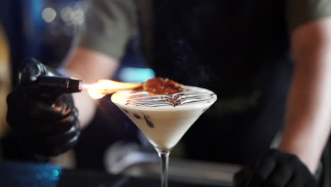 Latin-bartender-flaming-cinnamon-cocktail-with-torch-slow-motion-flame-gloves