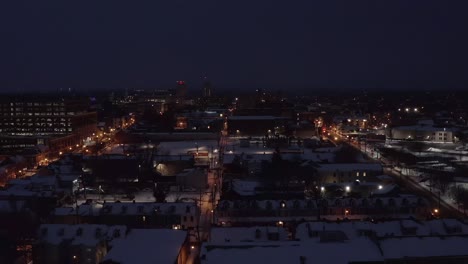 Rising-aerial-of-urban-city-in-USA-during-dark-winter-night