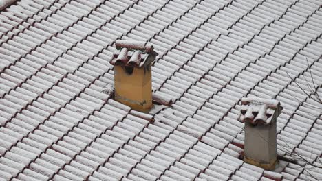 Old-brick-chimneys-snow-covered.-Bologna,-Italy