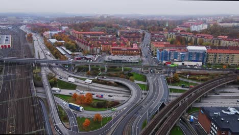 Aerial-View-Of-Empty-Train-Tracks-With-E20-Extent-Shared-With-E6-Road-In-Gothenburg-Sweden