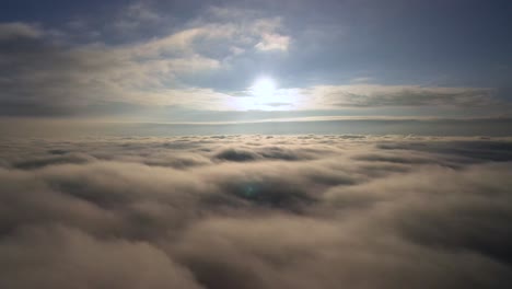 Calm-and-relaxing-aerial-view-above-clouds-during-sunrise