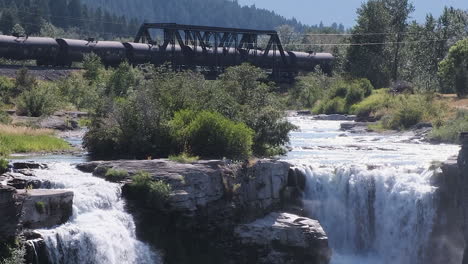 Creative-cinemagraph-of-CP-Rail-train-rolling-before-a-still-waterfall