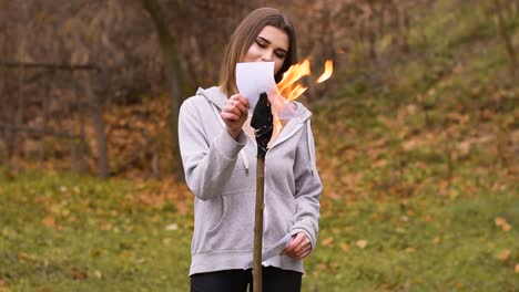 Beautiful-Vocalist-Woman-Singing-And-Burning-Photos-With-Torch