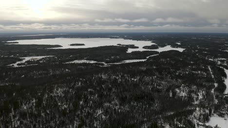 Aerial-shot-of-West-hawk-Lake,-Manitoba-in-winter-time