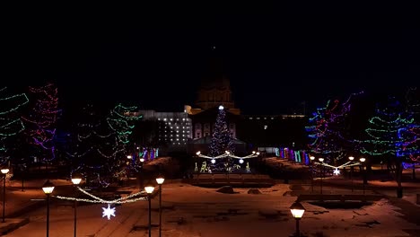 Stunning-decorative-winter-gardens-at-the-Capital-City-Edmonton-Alberta-Canada-Legislature-grounds-with-nobody-out-at-Lockdown-pandemic-COVID-19-crisis-with-bright-lit-vintage-light-posts-plants-trees