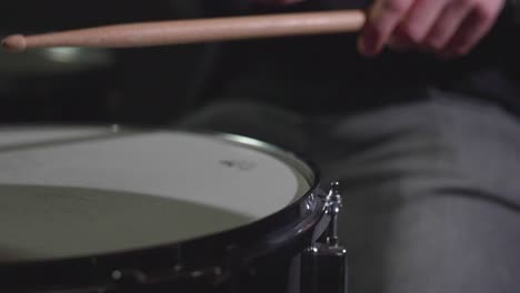 Smooth-close-up-of-a-shiny-drum-ride-cymbal-and-a-snare-being-played-with-sticks