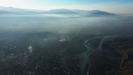 Scenic-Birdseye-View-Through-Fog-Of-Uplistsikhe-Landscape-With-Mtkvari-River-In-Georgia