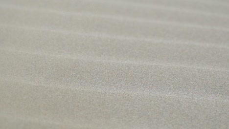 Close-up-of-rippled-sand-during-a-sand-storm-in-the-desert