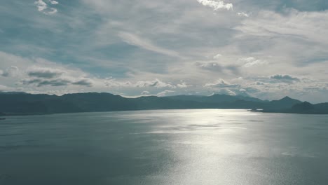 Drone-Aerial-overview-of-beautiful-blue-lake-Atitlan-and-the-mountains-around-it-in-Guatemala