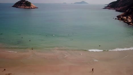 A-static-aerial-view-of-the-Shek-O-beach-in-Hong-Kong-as-public-beaches-reopening,-after-months-of-closure-amid-coronavirus-outbreak,-to-the-public