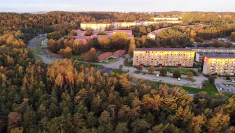 Drone-aerial-view-of-Gothenburg-suburbs-surrounded-by-woods,-Sweden,-day