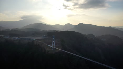 Cinematic-drone-shot-into-the-sun-of-the-suspension-bridge-Kokonoe-Yume-Otsurihasi