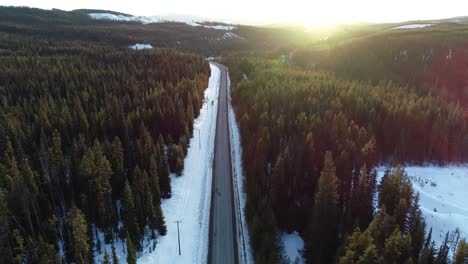 Idyllic-Winter-Landscape-and-Countryside-Road-on-Sunset-Sunlight,-Aerial-View