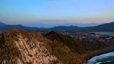 Cinematic-revealing-drone-shot-of-Kyushu-Japan's-rocky-coastline