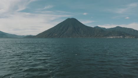 Drone-aerial-revealing-shot-of-San-Pedro-Volcano-in-Lake-Atitlan,-Guatemala