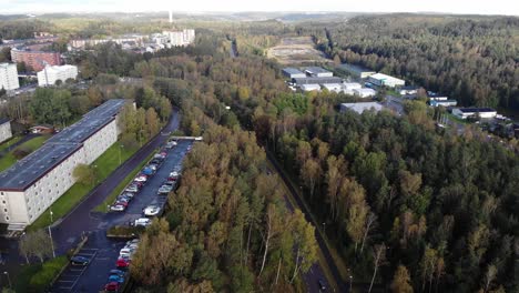 Slow-flyover-suburbs-of-Gothenburg,-Sweden-with-green-forest-surrounds