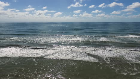 Sunny-Summer-Day-Above-Atlantic-Ocean-Horizon-and-Sandy-Beach,-Aerial-View