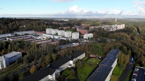 Aerial-flyover-of-apartment-buildings-and-woodland-at-Bergsjon,-Gothenburg,-Sweden