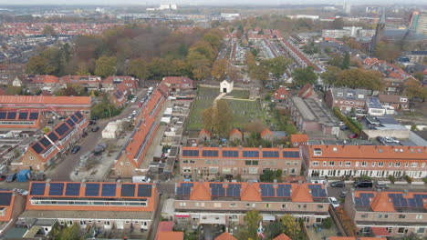 Aerial-dolly-of-rooftops-filled-with-solar-panels