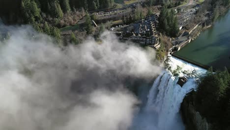 Aerial-flyover-famous-Snoqualmie-Falls-in-Washington-during-beautiful-sunny-day-with-fog