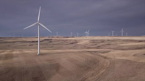 Creative-cinemagraph-of-windfarm-with-only-one-windmill-spinning