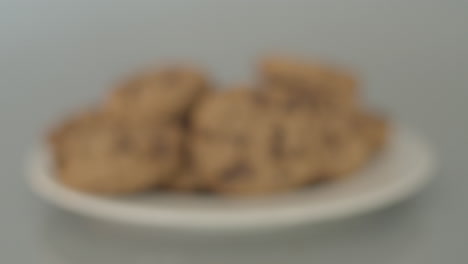 Dolly-in-of-pile-of-chocolate-chip-cookies---starting-out-of-focus
