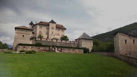 Italian-castle-on-a-hill-with-countryside-background