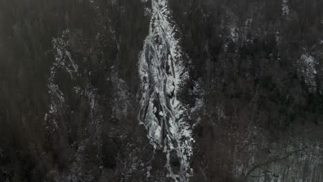 White-mountain-waterfall-of-Valle-Du-Bras-Du-Nord-in-Canada--aerial