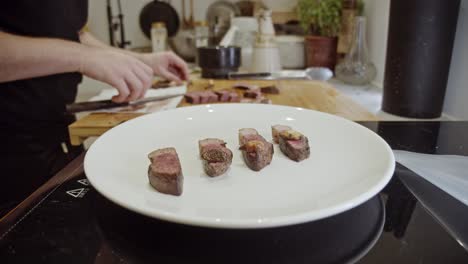 Decorating-steak-dish-on-a-white-plate