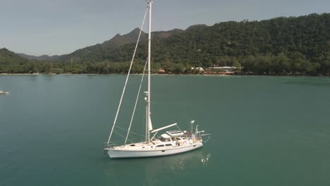 Aerial-view-of-sailing-Yacht,-ocean-with-Koh-Chang-island-mountains