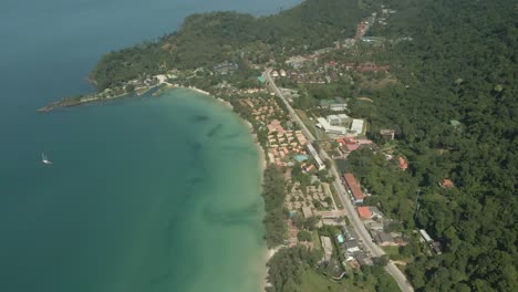 Aerial-tilt-down-shot-of-Koh-Chang,-Klong-Prao-village-beach-coastline-jungle