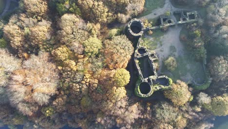 Liverpool-castle-replica-ruins-in-Autumn-Rivington-woodland-nature-Landmark-aerial-view-top-down-rotate-left