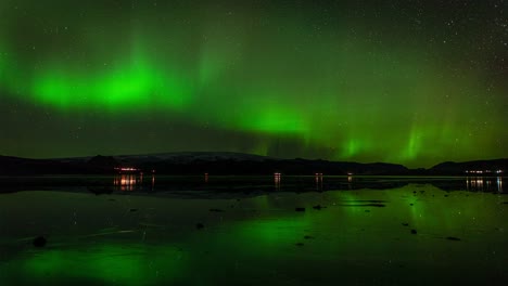 Striking-Aurora-Borealis-Over-Calm-Lake-In-Iceland---time-lapse