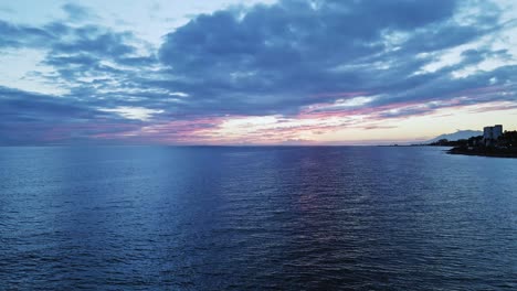 Dramatic-aerial-view-of-cloudy-horizon-with-slow-pedestal-up