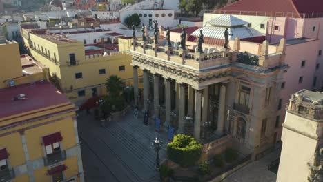 Aerial-Dolly-In-Pan-Down-Reveals-Famous-Teatro-Juarez-in-Guanajuato,-Mexico