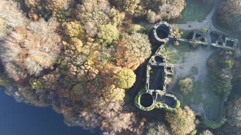 Old-fashioned-Liverpool-castle-replica-ruins-in-Autumn-Rivington-woodland-nature-Landmark-aerial-view-rising
