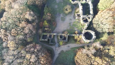 Historic-Liverpool-castle-replica-ruins-in-Autumn-Rivington-reservoir-woodland-nature-Landmark-aerial-view