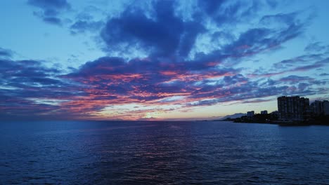 Dramatic-view-of-cloudy-sunset-or-sunrise-over-the-sea