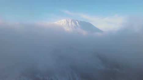 Beautiful-Mount-Gaustatoppen-surrounded-by-clouds-at-sunrise
