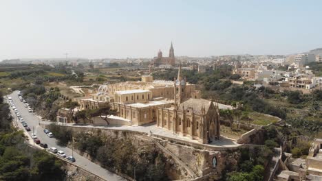 4k-aerial-drone-footage-circling-the-Church-Ghajnsielem-Parish-in-the-Mediterranean-town-of-Mgarr---Gozo,-Malta